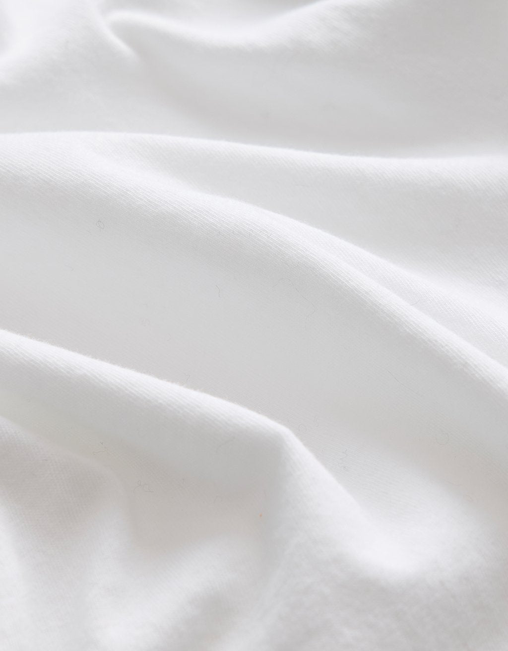 Close-up of white fabric with folds