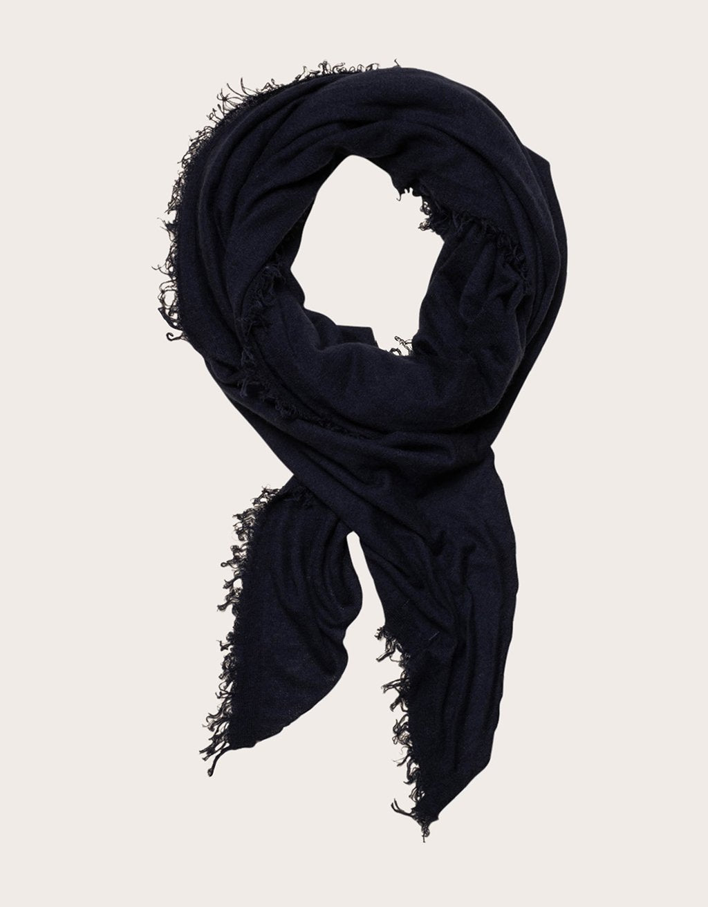 Navy blue cashmere scarf with frayed edges on a light background