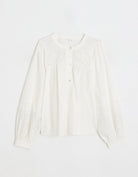 White embroidered poplin blouse with long sleeves on a white background