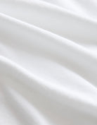 Close-up of white fabric with folds