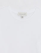 White t-shirt with an unsubscribed brand label on a white background