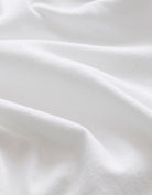 Close-up of white fabric with folds